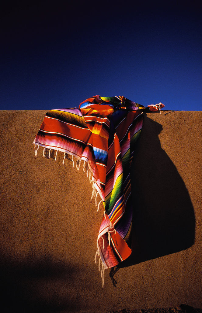 Detail of Southwest Blanket on Adobe Wall by Corbis