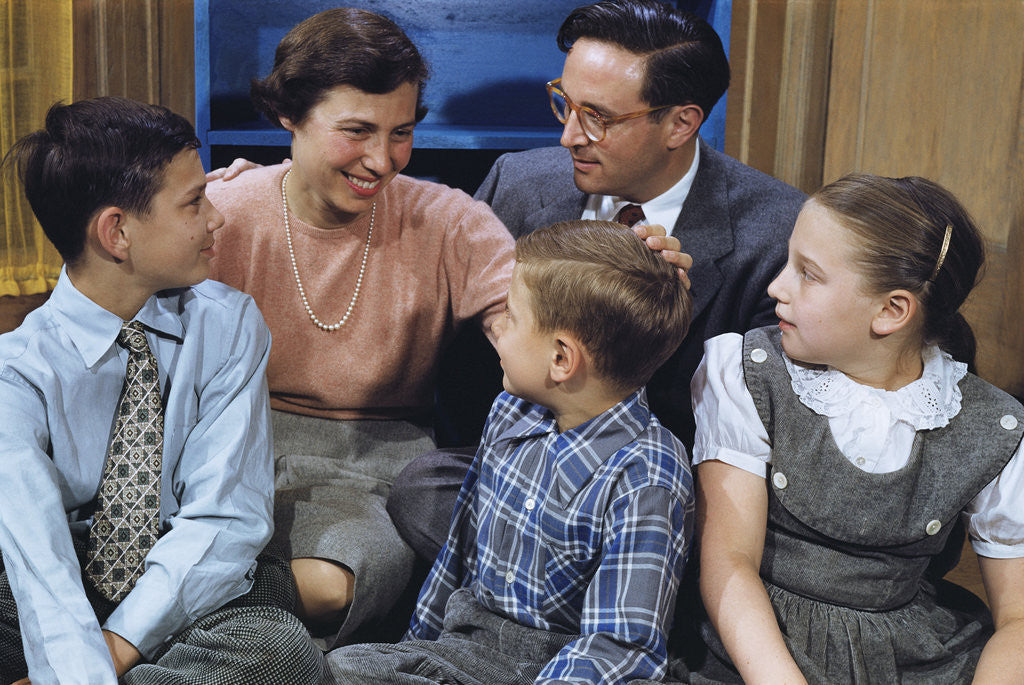 Detail of Happy Family Gathered Together at Home by Corbis