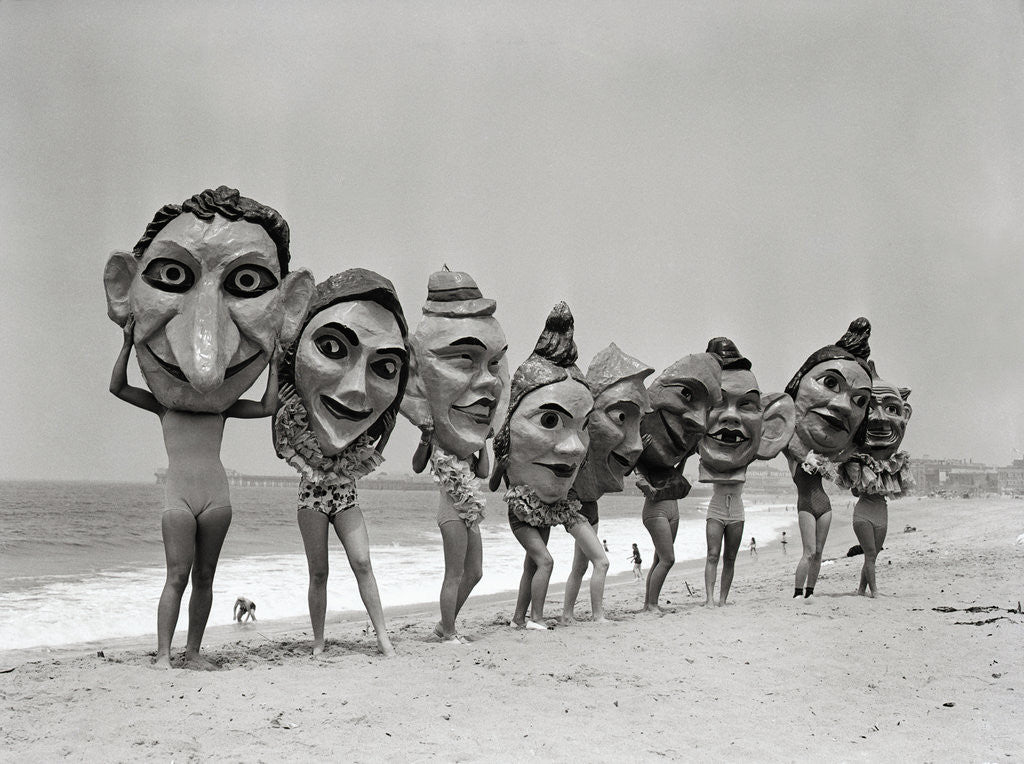 Detail of Women Holding Giant Masks by Corbis