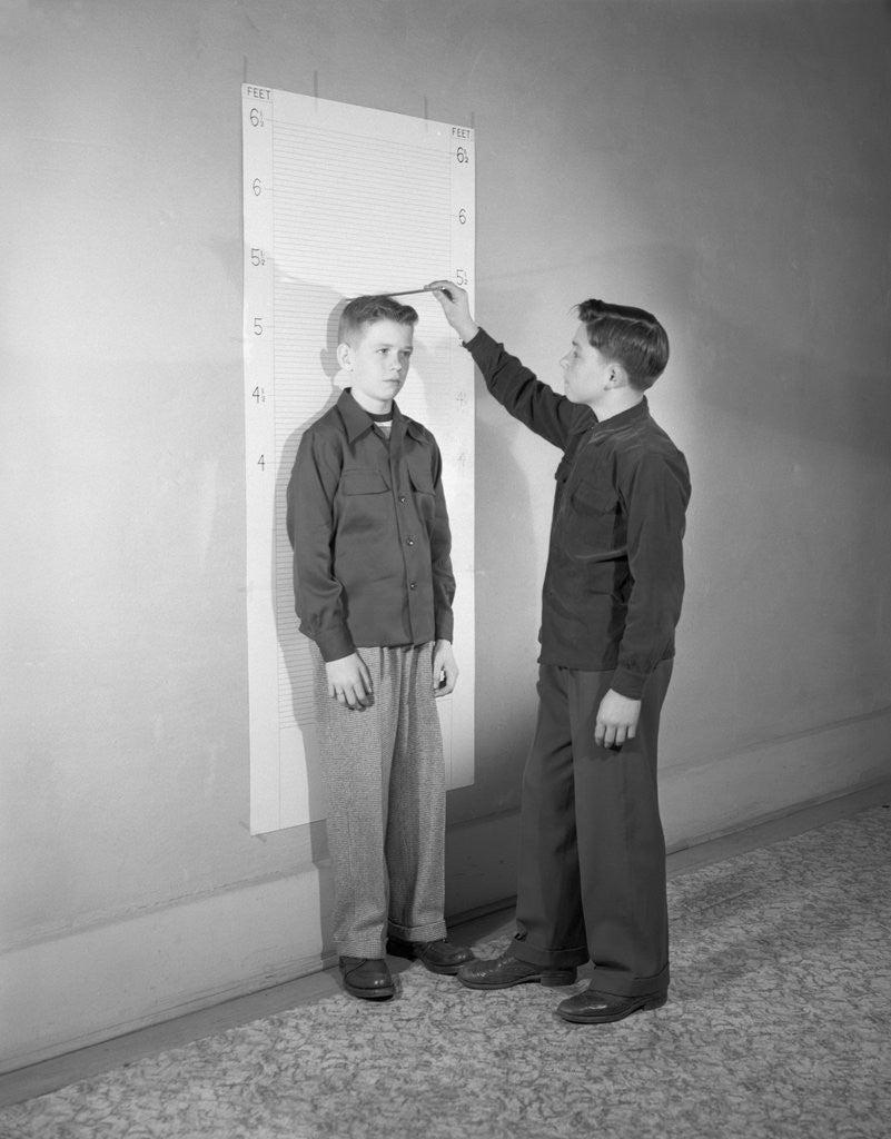 Detail of Boys Measuring Each Other by Corbis