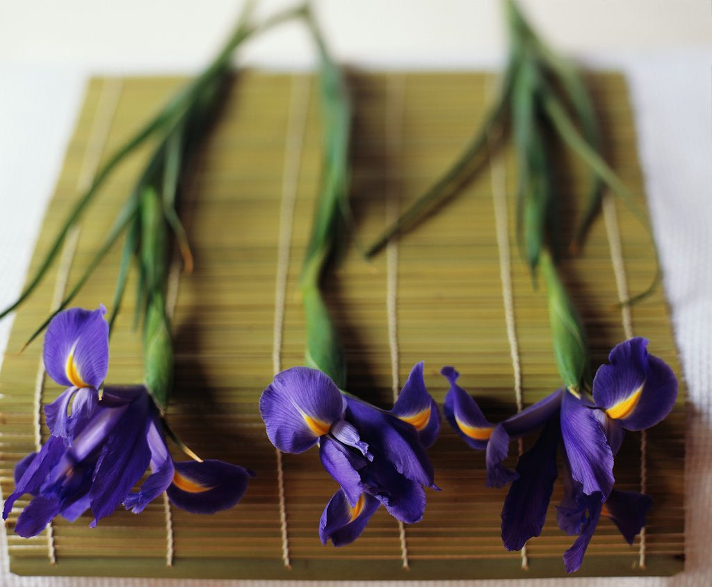 Detail of Purple Irises on a Bamboo Mat by Corbis