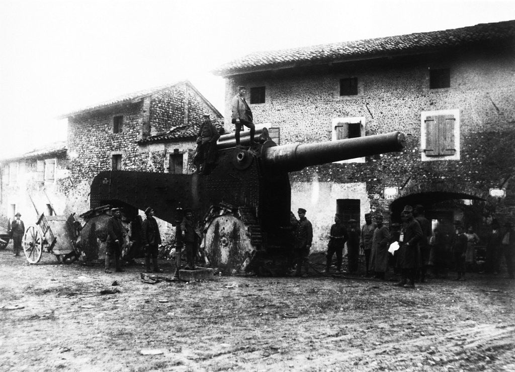 Detail of German troops examine heavy and gigantic cannons deserted by fleeing Italians in a village behind Udine. by Corbis