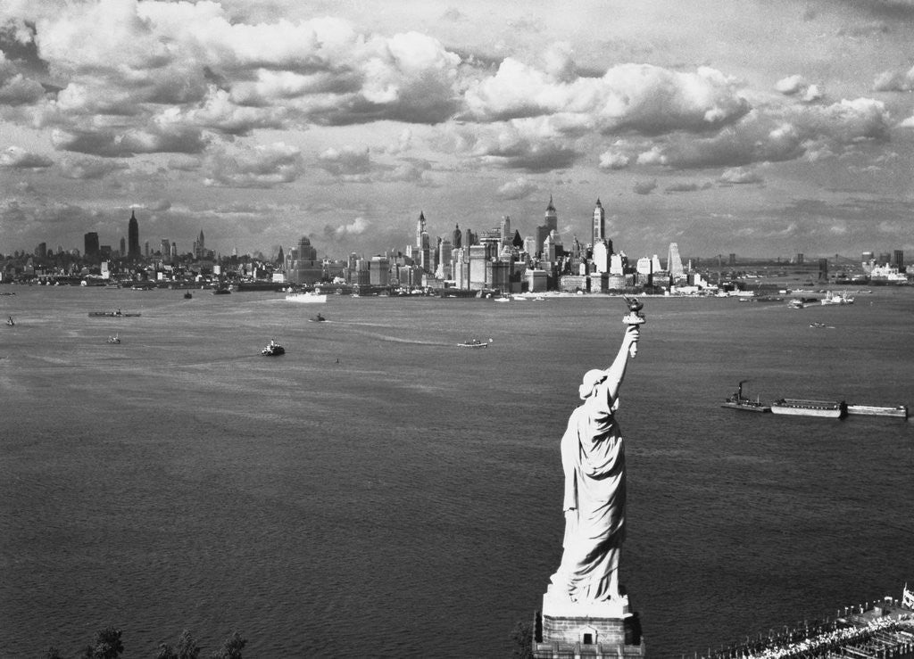 Detail of Aerial View of Statue of Liberty and New York City Skyline by Corbis